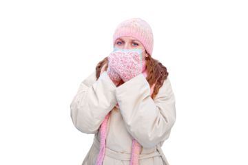 Sick woman coughs in a winter park with snowy s with a face mask, isolated on a white background. New Year in a park with snowy s