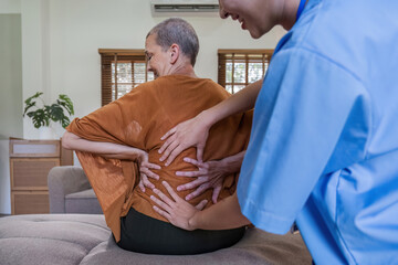 Caucasian senior woman 60s doing physiotherapist with support from nurse. Senior elderly female...