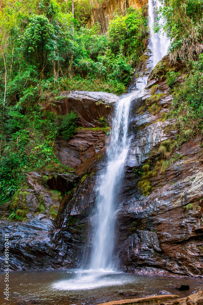 Wall mural water running over rocks in a waterfall in the interior of the state of minas gerais, brazil