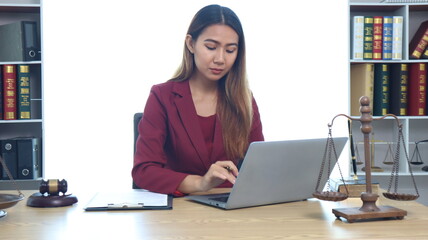 Portrait of a young female lawyer or lawyer working in an office. Smile and look at the camera.