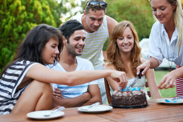 Birthday, friends and cutting cake outdoor for celebration, surprise or party with milestone or...