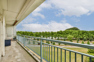 a balcony with blue sky and white clouds in the background, taken from an apartment balcony at sunset point apartments