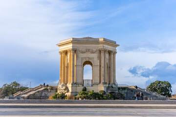 Montpellier, France - January 16 2023 - The Château d’eau du Peyrou at the Bassin principal du Peyrou. The water building and pond at the promenade du Peyrou - obrazy, fototapety, plakaty