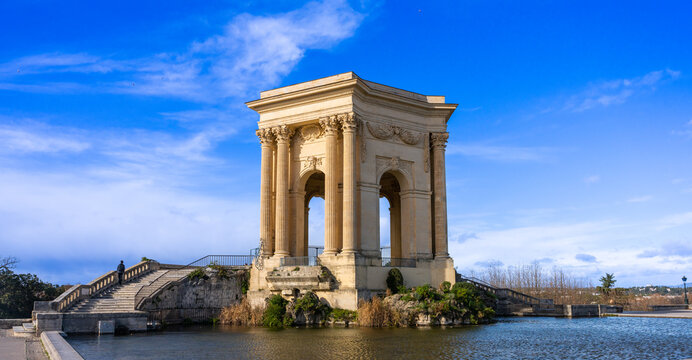 Montpellier, France - January 16 2023 - The Ch&acirc;teau d&rsquo;eau du Peyrou at the Bassin principal du Peyrou. The water building and pond at the promenade du Peyrou