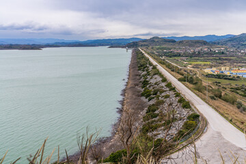 Fototapeta na wymiar Pinios, Greece - 5 february 2023 - Overview of the Pinios Dam at the Pinios Lake