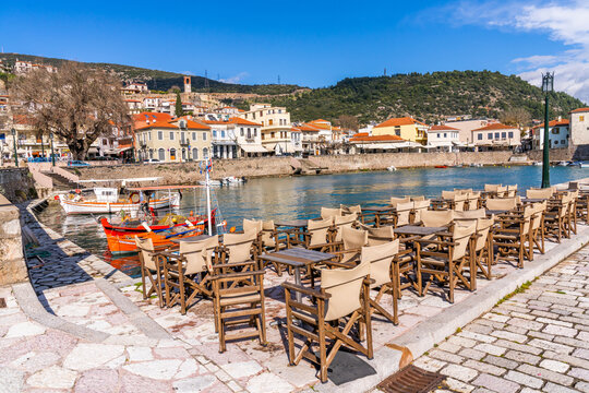 Nafpaktos, Greece - 4 february 2023 - The old city at the waterfront of the old venetian town with a terrace waiting for guests