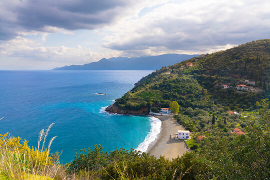 Leonidas, Greece - 13 February 2023 - View on small beach with houses on the Peleponnese peninsula of Greece