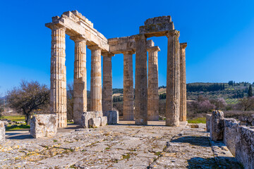 Nemea, Greece - 22 February 2023 - Ruins of the temple of Zeus at the old town of Nemea - obrazy, fototapety, plakaty