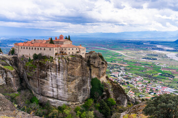 Fototapeta na wymiar Meteora, Greece - 28 March 2023 - Monastery of the Holy Trinity at Meteora seen from a distance