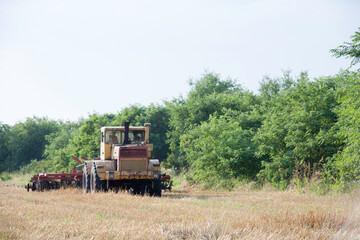 Obraz premium Russian tractor K-700 Kirovets. Large yellow USSR tractor designed for towing military equipment