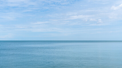 Fototapeta na wymiar The water sea is clear and bright blue. wide sea view, landscape blue ocean waves.