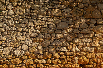 Detail shot of a plain limestone wall - stock photo