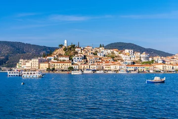 Tuinposter Poros, Greece - 17 February 2023 - View on the town of Poros on Poros island seen from the mainland © ivoderooij