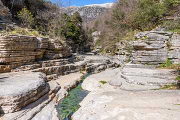 The Papingo Rock Pools in the Vikos Moutains with natural pancake rocks © ivoderooij