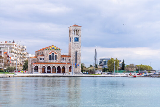Volos, Greece - 16 March 2023 -Orthodox church of St. Constantine and Elena seen from the water
