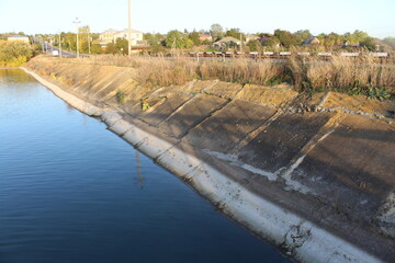 A water channel with a concrete wall