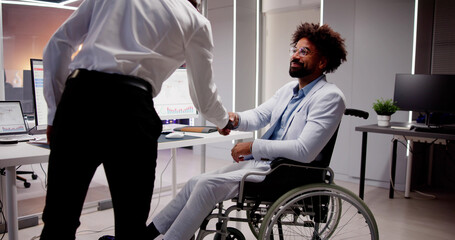 Business Person In Wheel Chair Shaking