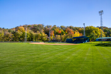 Fall colors on the hillside by Jordan Minnesota community baseball field - obrazy, fototapety, plakaty