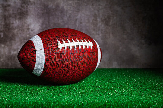 An American Football ball over grass
