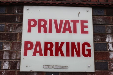 Naklejka premium White sign with red text 