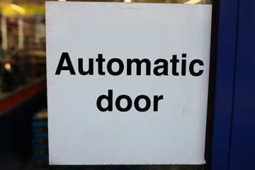 Automatic door sticker black text and white background UK