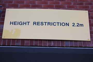 Yellow height restriction sign 
