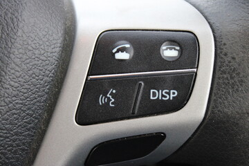 Close up of a control panel from a car steering wheel, buttons to pickup and end a call
