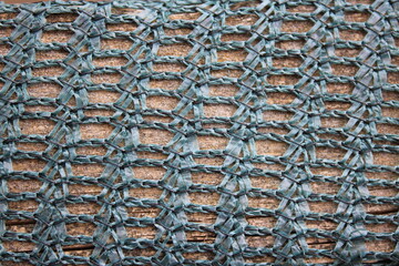Up close picture of green fabric garden netting