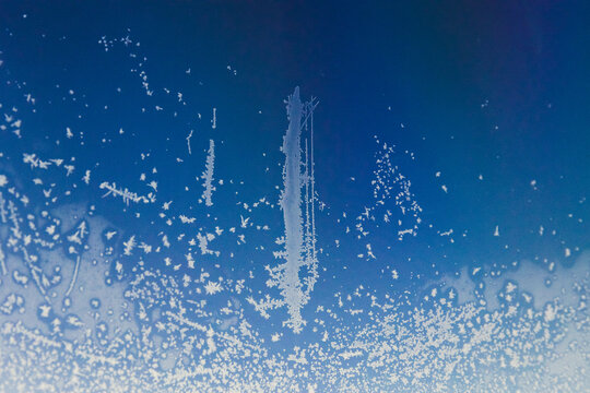 Frozen frost on the window glass. - Powered by Adobe