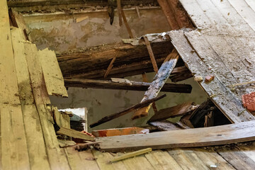 a rotten wooden floor with hole