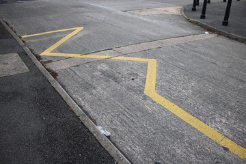 Yellow Zig Zag lines UK indicating to motorists to keep clear, no parking taken outside school...