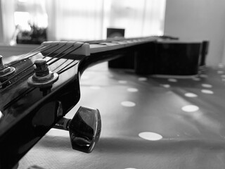 A 6 String acoustic guitar close up picture focused on the guitar head