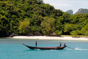 Traditional Thai long tail boat on the beach in Krabi, Thailand