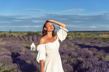 Summer sunny evening with a young woman