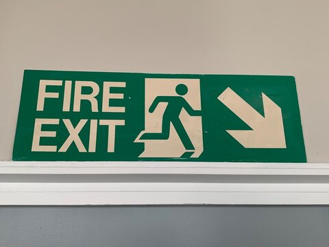 UK green and white fire exit sign
