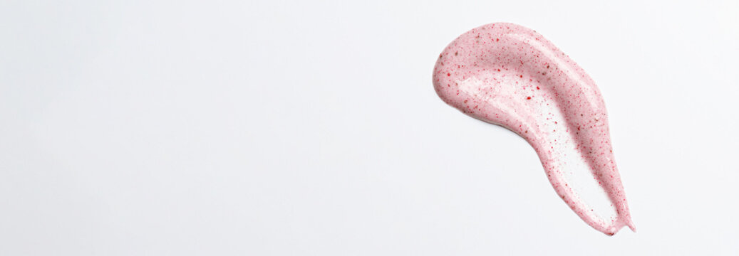 A sample of a scrub cream for washing. An exfoliating skin care product. White background. Copy space