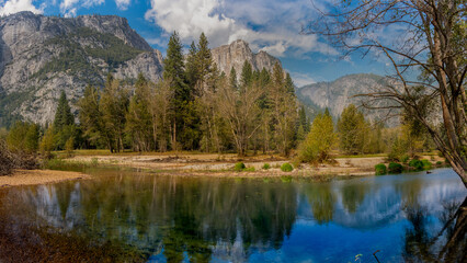 Yosemite,Merced river reflecting the mountains and sky above in the valley of where beauty surrounds you