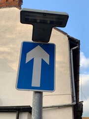 Blue one way road sign arrow pointing up UK