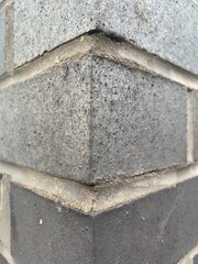Corner of a black brick wall, perspective focus