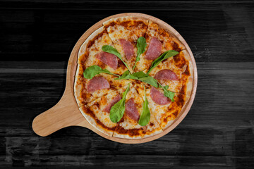 Top view of Parma Ham Pizza on wood table background