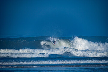 Bodyboarder surfing ocean wave