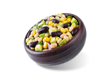 White beans kidney beans corn avocado salad in a bowl on a white isolated background