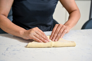 woman kneading dough