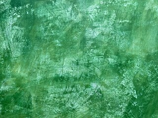 Green plaster wall with crackle texture background in Oaxaca, Mexico.