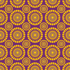 Floral pattern with round flowers. Seamless pattern with abstract yellow flowers on a purple background.