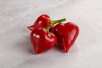 Red spicy cherry pepper heap