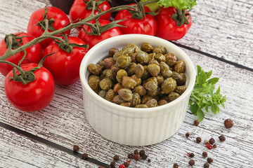 Marinated green capers in the bowl