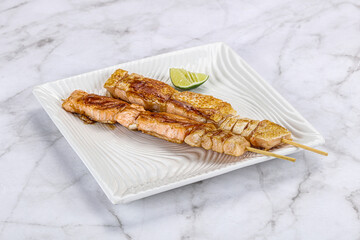Grilled salmon skewer with sauce