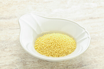 Raw couscous in the bowl