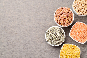 Top view of uncooked legumes and beans on the table